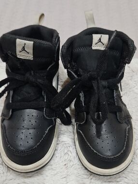 Jordan Kids Black and White High-Top Sneakers